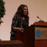 Dionna Cheatham presenting at podium